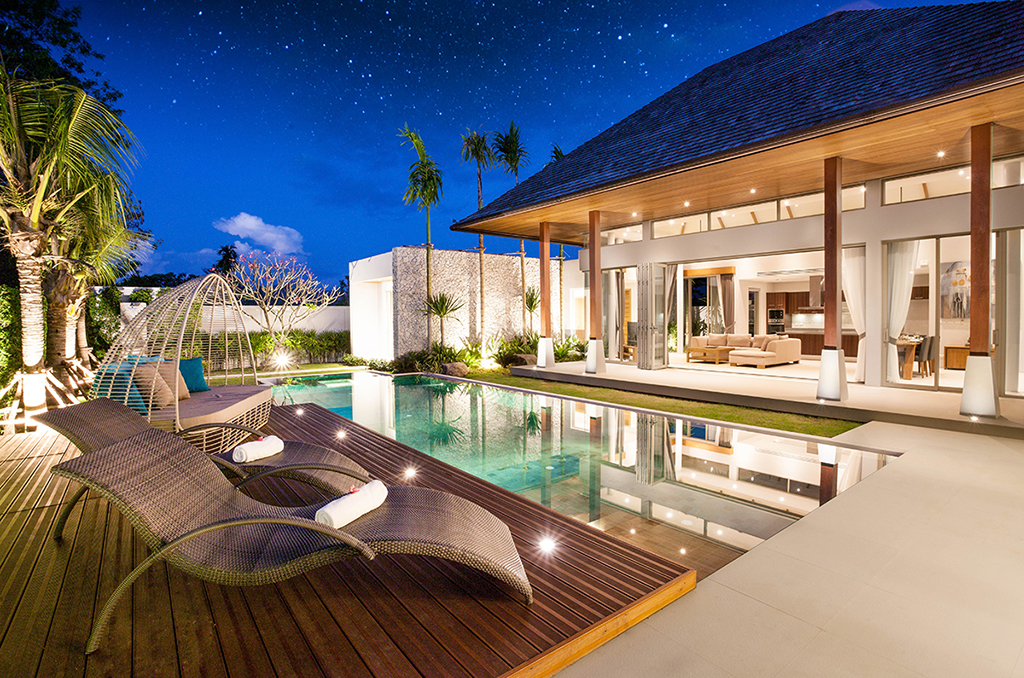 Luxury home with pool and palm trees