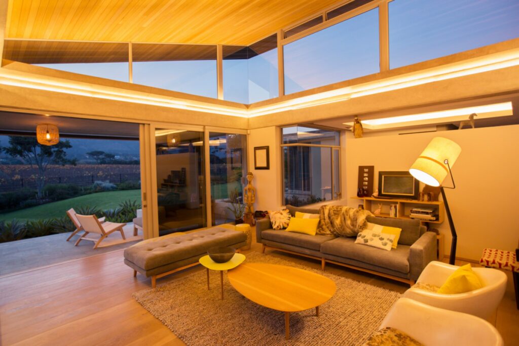 Illuminated showcase living room in a modern home overlooking the mountains